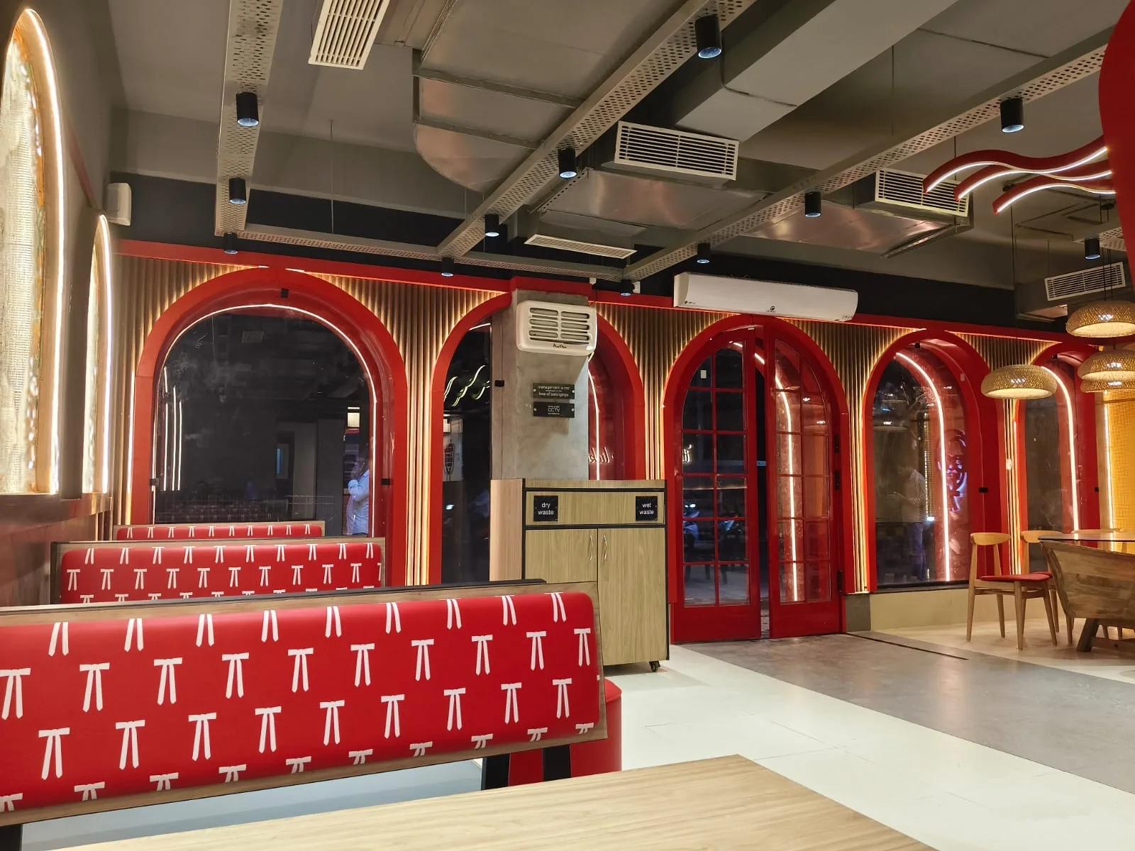 Completed KFC restaurant dining area with illuminated arches